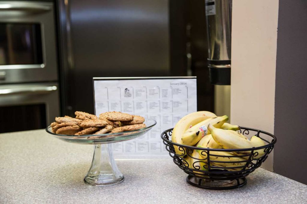 Cookies, Bananas and Monthly Menu Displayed on Counter